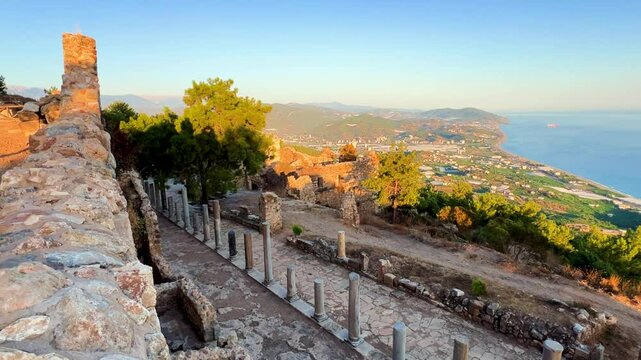 Ruins of the ancient Roman port city of Siedra in Alanya, Antalya, Turkey. The street and ruins of the ancient abandoned ancient city of Siedra on the Mediterranean coast. 4К