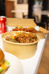 Korean deep dried chicken on white rice with soy garlic sauce.