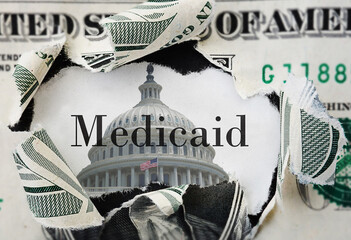 Torn dollar bill with medicaid text and US Capitol