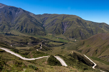Stunning panoramic views of winding roads and dramatic mountain landscapes at Cuesta del Obispo, a...