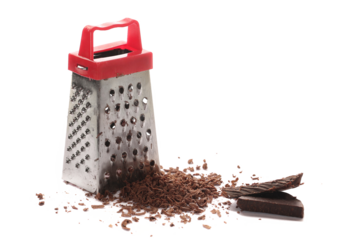Kitchen grater and pile chopped, dark chocolate isolated on white background