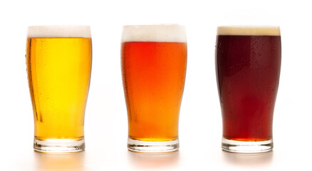 Different types of craft fresh drink. Assortment of beer in tall glasses. Light, barley and dark lager in glasses, isolated on white background, mockup, studio shot, close up, free space