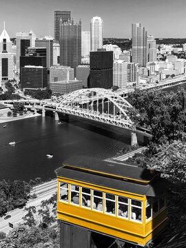 Pittsburgh Pennsylvania - the historic Duquesne incline climbs above the Monongahela River and Fort Pitt Bridge in yellow black and white