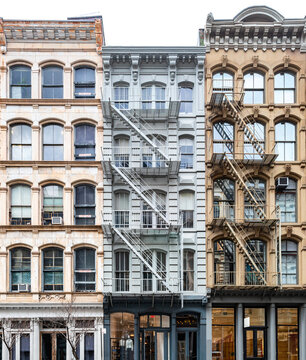 Exterior view of windows of the old historic buildings on Broadway in the SoHo neighborhood of Manhattan in New York City