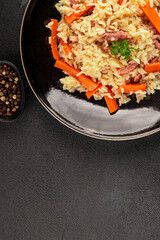 Rice meat and vegetables pilaf fresh delicious gourmet food background on the table rustic food top view copy space