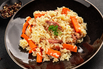 Rice meat and vegetables pilaf fresh delicious gourmet food background on the table rustic food top view copy space