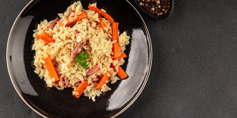 Rice meat and vegetables pilaf fresh delicious gourmet food background on the table rustic food top view copy space