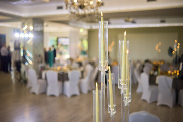 An Elegant Event Venue featuring Candlelit Centerpieces and Exquisitely Refined