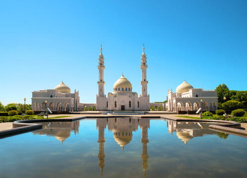 A White Mosque with a reflection on a sunny summer day. Muslim Shrine, an architectural complex in Bolgar, Republic of Tatarstan