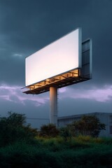 Modern digital billboard against storm clouds at sunset.