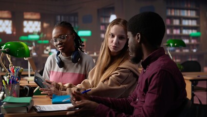 Diverse group of entrepreneurship students learning about leadership and finances for business administration skills, career focused pupils. People study taxes and accounting. Camera A.