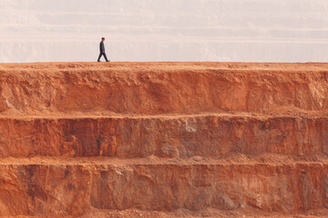 vast open pit mine in mongolia casting long shadows in rich color tones