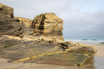Playa de las Catedrales (Beach of the Cathedrals) reveals extraordinary cliffs and caves shaped by the sea, Ribadeo, Spain, perfect for nature and landscape lovers, empty and peaceful.