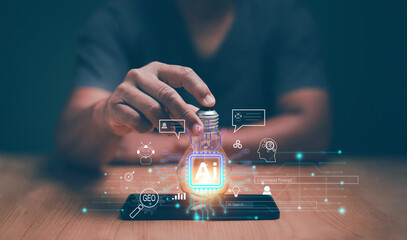 Artificial Intelligence concept. Innovative AI technology for business, Businessman holding lightbulb and smartphone for chat and generate something by Ai tech. Futuristic innovative technology..