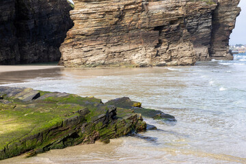 Playa de las Catedrales (Beach of the Cathedrals) reveals extraordinary cliffs and caves shaped by the sea, Ribadeo, Spain, perfect for nature and landscape lovers, empty and peaceful.