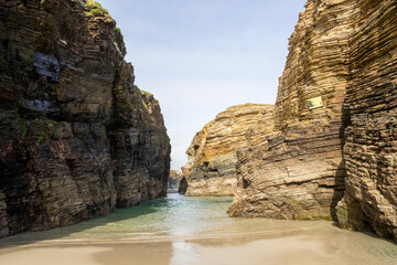 Playa de las Catedrales (Beach of the Cathedrals) reveals extraordinary cliffs and caves shaped by the sea, Ribadeo, Spain, perfect for nature and landscape lovers, empty and peaceful.