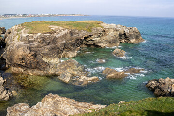 Beautiful cliffs of Playa de las Catedrales viewed from a wooden boardwalk in Ribadeo, Galicia. Nature and coastal beauty combined.