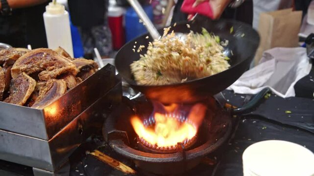 Street Food Cooking with Wok and Fire in the Philippines