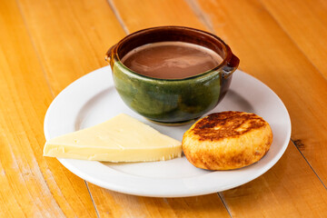 Boyaca arepa with cheese and a cup of hot chocolate - Traditional breakfast