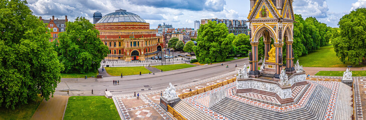 Aerial view of the Royal Albert Hall in London, surrounded by classic red-brick buildings, roads, and green trees