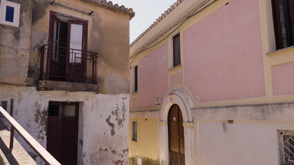 Traditional colorful houses with open balcony and wooden doors in Pizzo, Calabria, Southern Italy