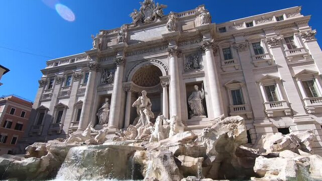 Coin getting tossed in the Trevi Fountain in Rome, Italy