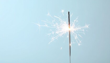 Obraz premium White Sparklers on a Light Blue Background