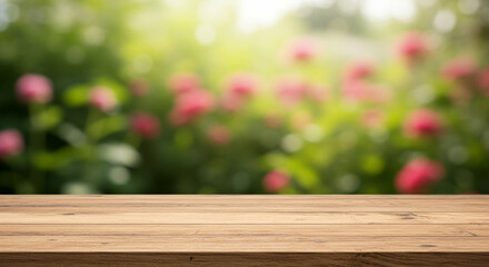 Wooden table with blurred background of flowers and green foliage garden scene