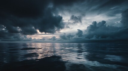 Fototapeta premium Dark sea surface with a dramatic cloudy sky above, approaching storm