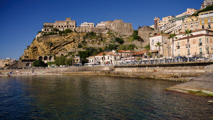 Pizzo Calabro cityscape with colorful houses, the Murat Castle and the Piedigrotta Church overlooking the sea in Calabria, Southern Italy