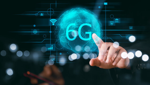 The concept of 6G network, high-speed mobile Internet, new generation networks. Business, modern technology, internet and networking concept. A person is holding a cell phone with the word 6G on it.