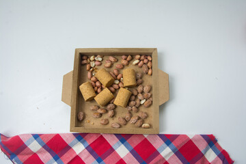 Paçoca , Peanuts and Peanuts Praliné on a white background. Close-up.