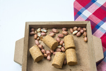 Paçoca , Peanuts and Peanuts Praliné on a white background. Close-up.