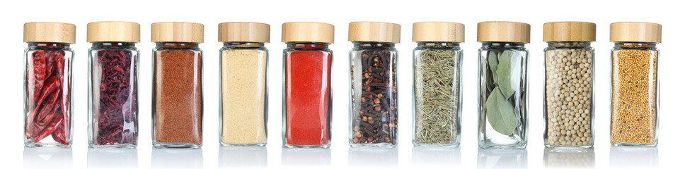 Different spices in glass jars on white background, set