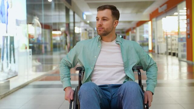 Happy person with disability sitting in wheelchair in shopping mall