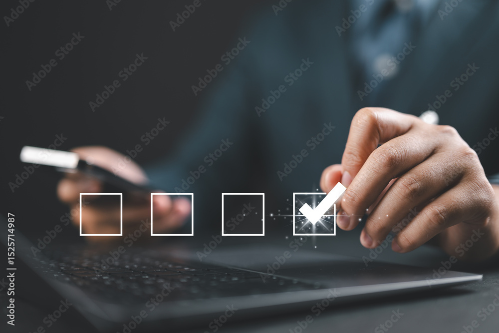 Poster businessman completing digital checklist on laptop. concept of productivity and task management. use