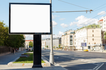 Empty big billboard in the city in summer afternoon. Mock-up.