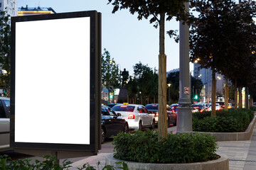 Vertical billboard near the road in the city. Traffic jam, bottleneck. Mock-up.
