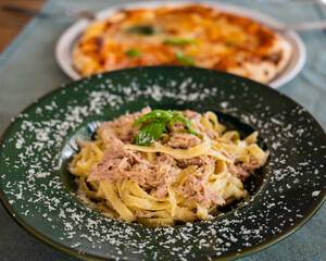 Pizza and pasta in the restaurant. 