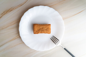 Baked Financier on White Plate
