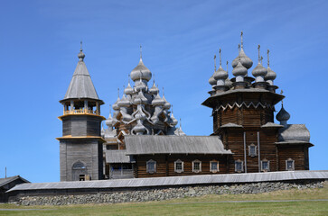 Medieval wooden bell tower and Church of the Transfiguration of the Lord built in 1714 on Kizhi Island on Onega Lake in Karelia