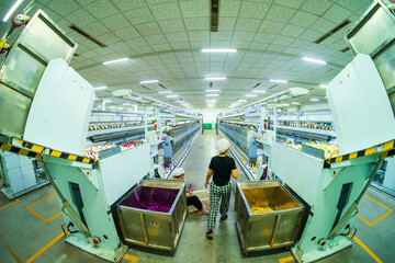 Workers are working in the production workshop of the spinning mill
