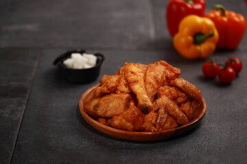 Korean Fried Chicken – Crispy Drumsticks and Wings on Dark Background