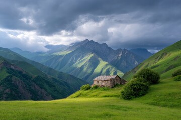Obraz premium Stone house nestled in a green valley mountains and moody sky backdrop