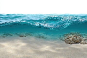 Obraz premium Turquoise water meets tan sand in an ocean scene with light filtering to the seabed displaying coral
