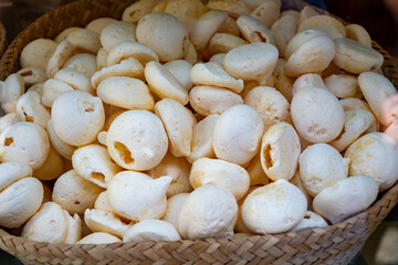 Fresh baked eggs meringues with various tastes on window display in confectionery shop in old Bruges, Belgian sweets