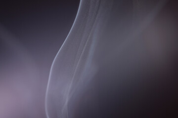 Macro shot of smoke vapour particles release in the air