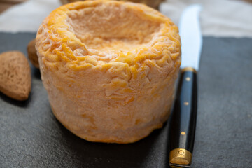 French Langres soft cows crumbly cheese with washed rind structure made in Champagne - Ardenne region
