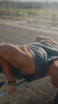 An athletic person in a park setting performing push-ups on an outdoor exercise bar. The sunlight and surroundings create a dynamic and energetic atmosphere. Athlete Performing Push-Ups on Outdoor
