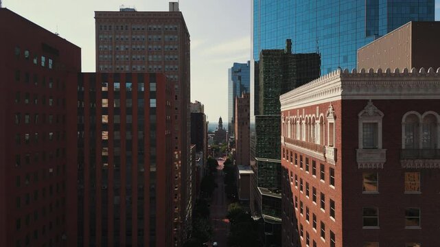 Drone Flying Between Buildings on Main Street in Fort Worth, Texas